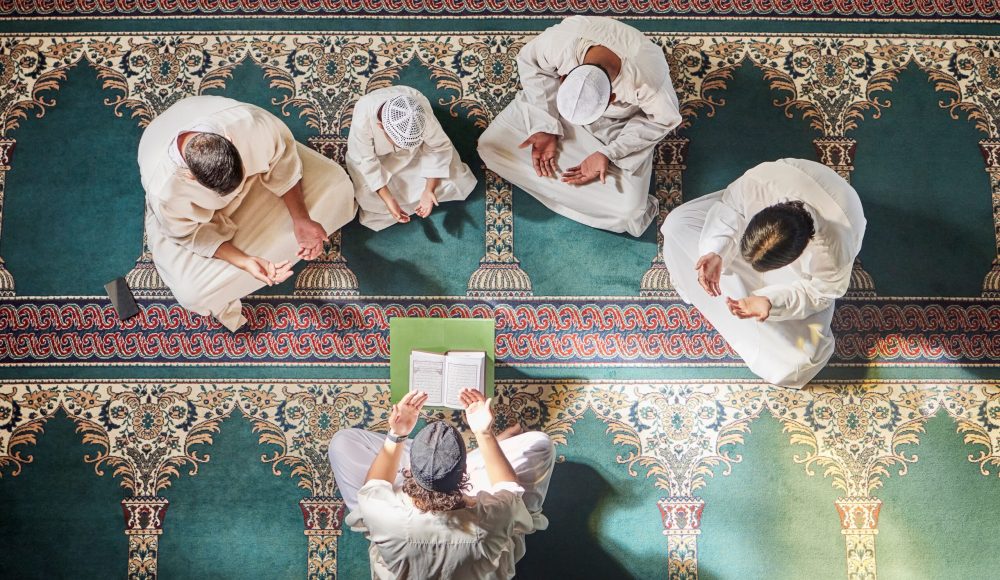 Above mosque carpet, group and quran for faith, religion and prayer for gratitude, peace or mindful.